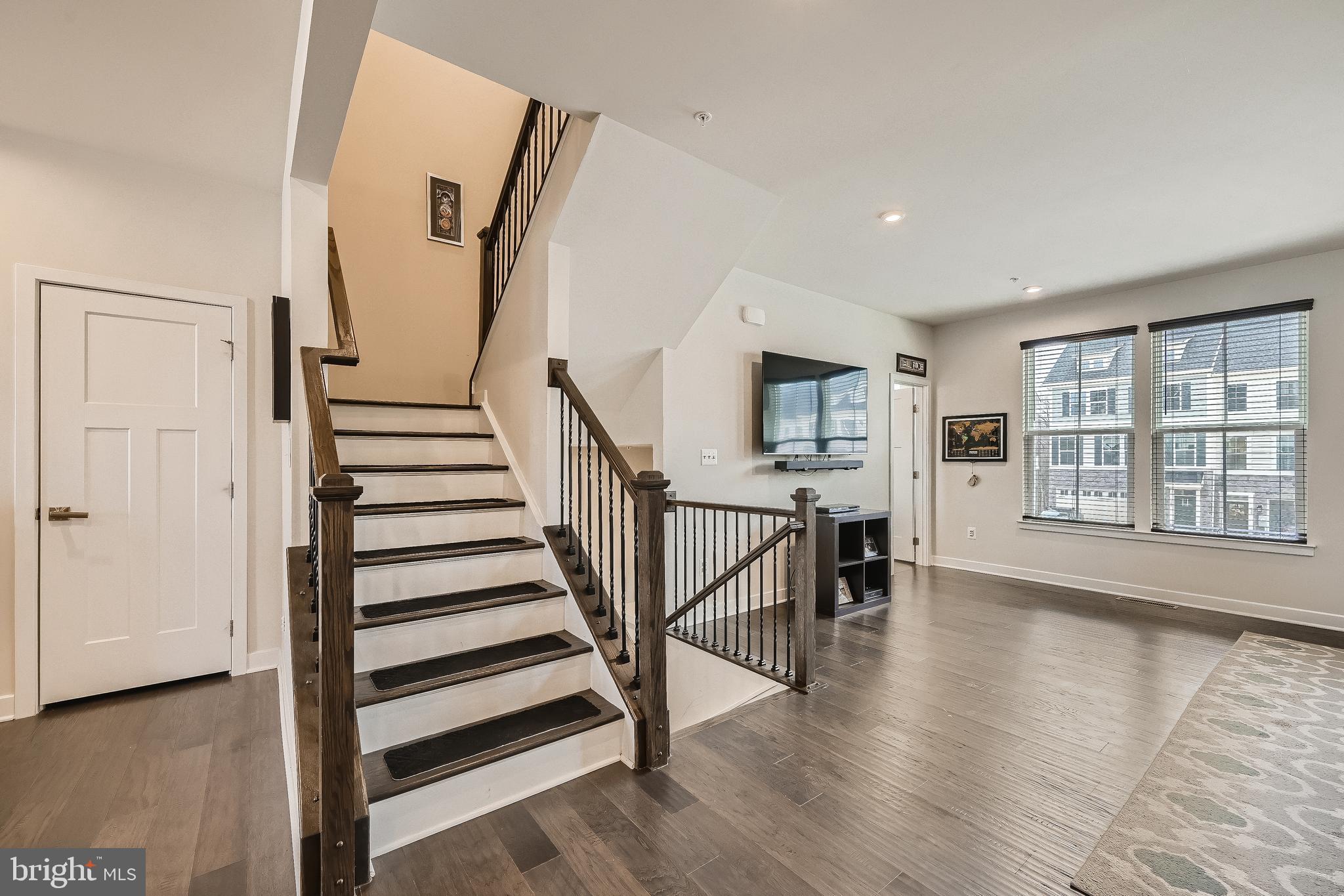 737 Iron Gate Road Bel Air, MD 21014 - Photo 13 of 27 a view of a hallway with wooden floor and staircase