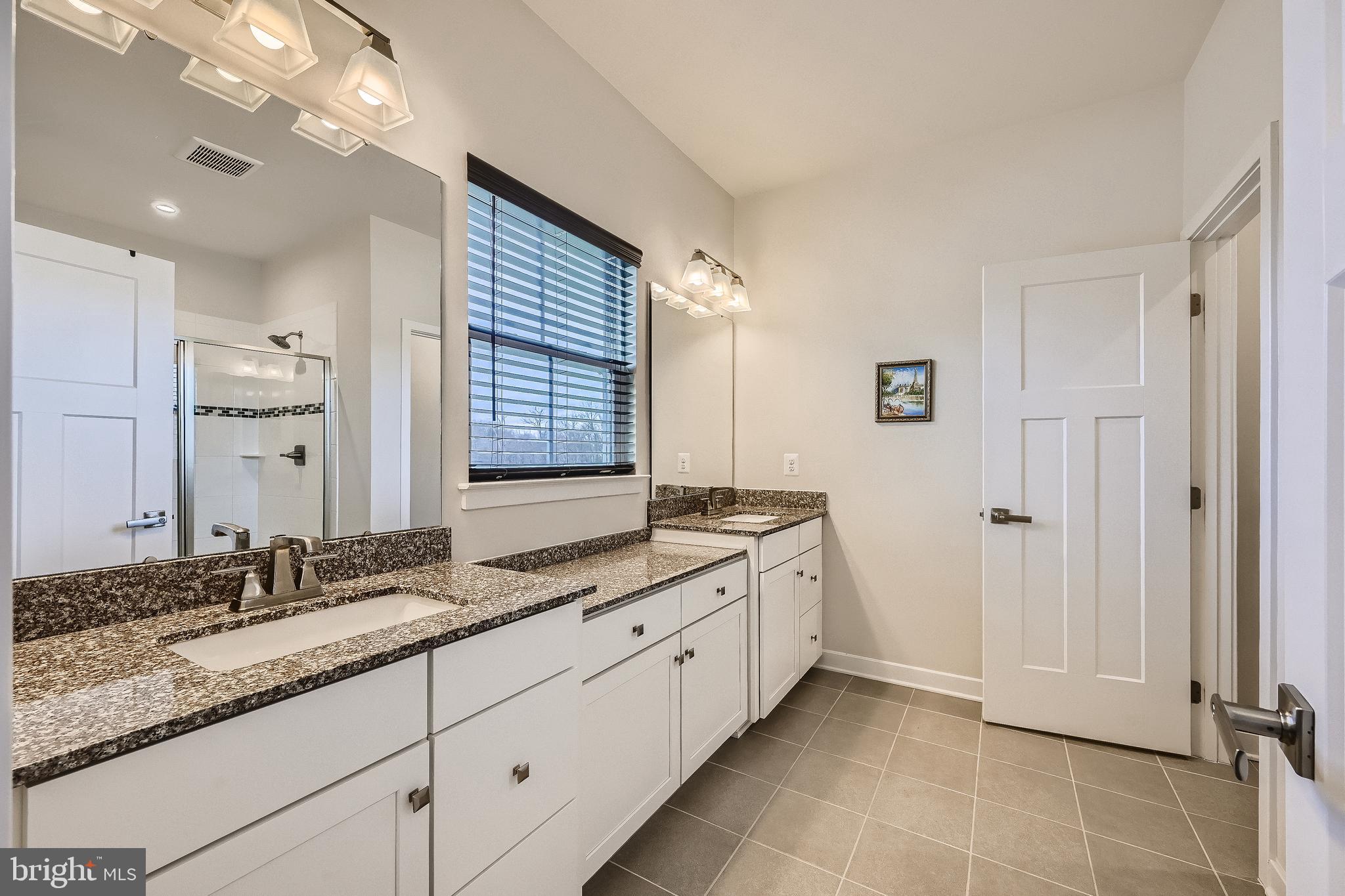 737 Iron Gate Road Bel Air, MD 21014 - Photo 15 of 27 a bathroom with a granite countertop double vanity sink and mirror
