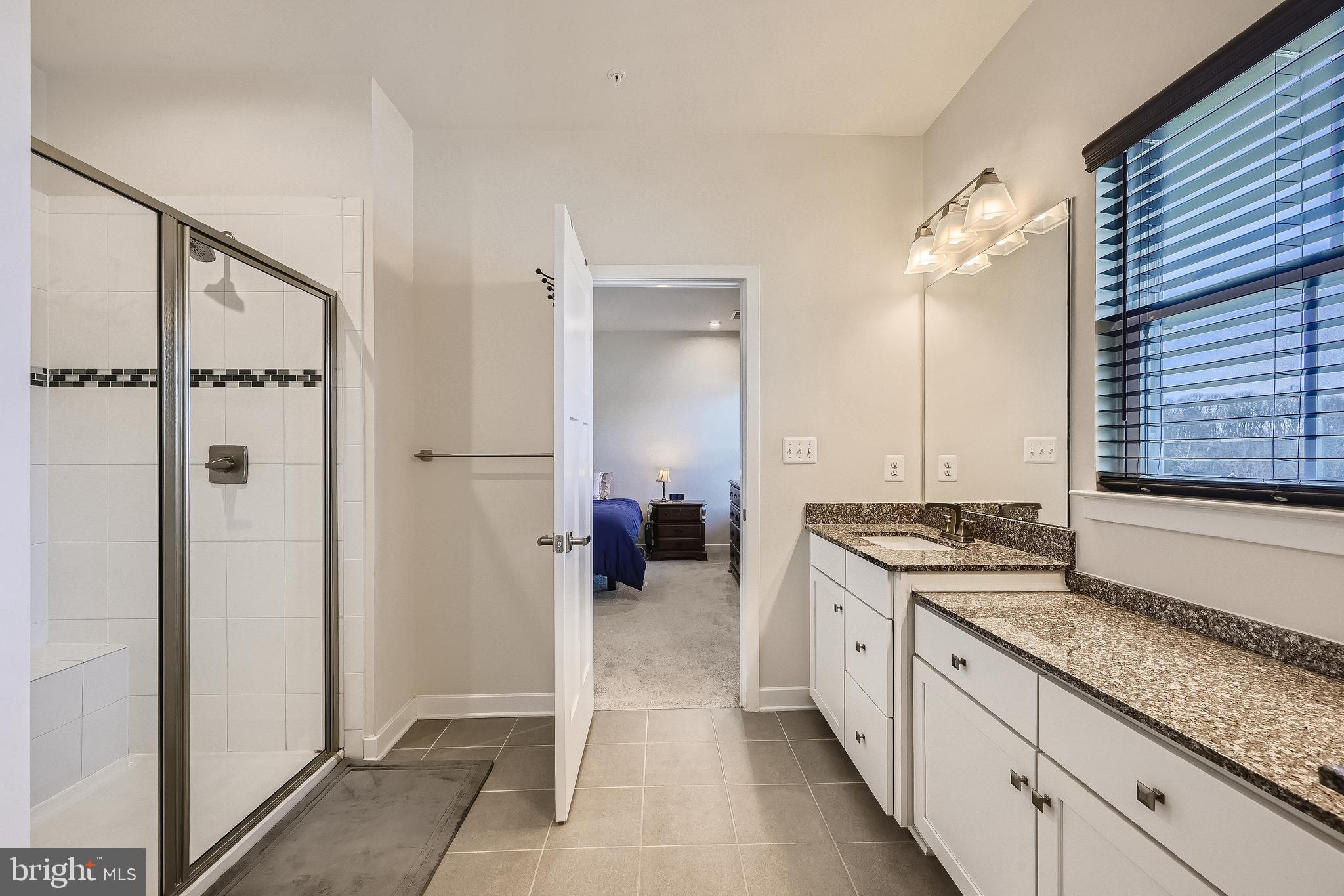 737 Iron Gate Road Bel Air, MD 21014 - Photo 16 of 27 a large white kitchen with a sink and a wooden floor