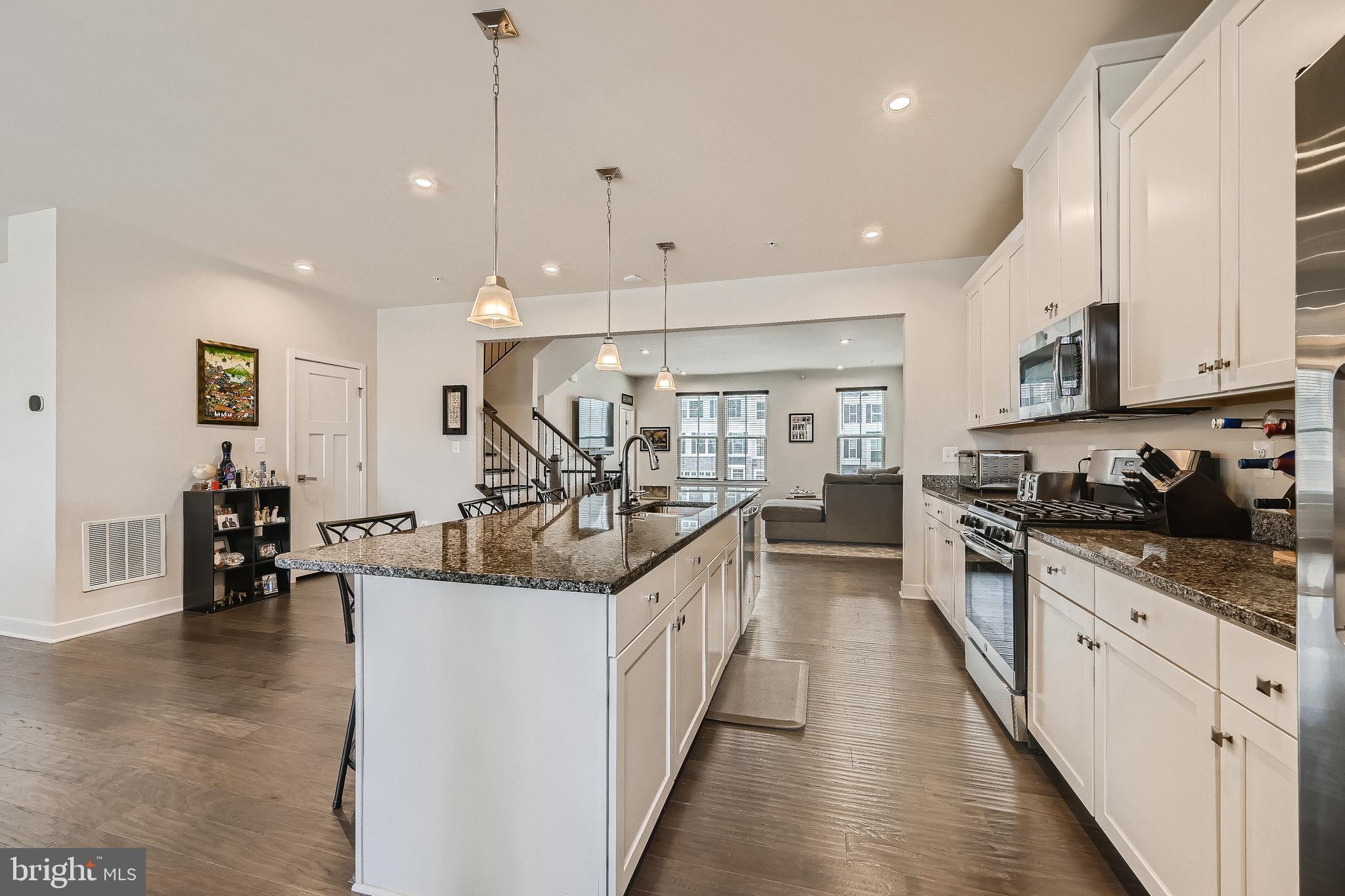 737 Iron Gate Road Bel Air, MD 21014 - Photo 9 of 27 a large kitchen with stainless steel appliances kitchen island granite countertop lots of counter top and sink