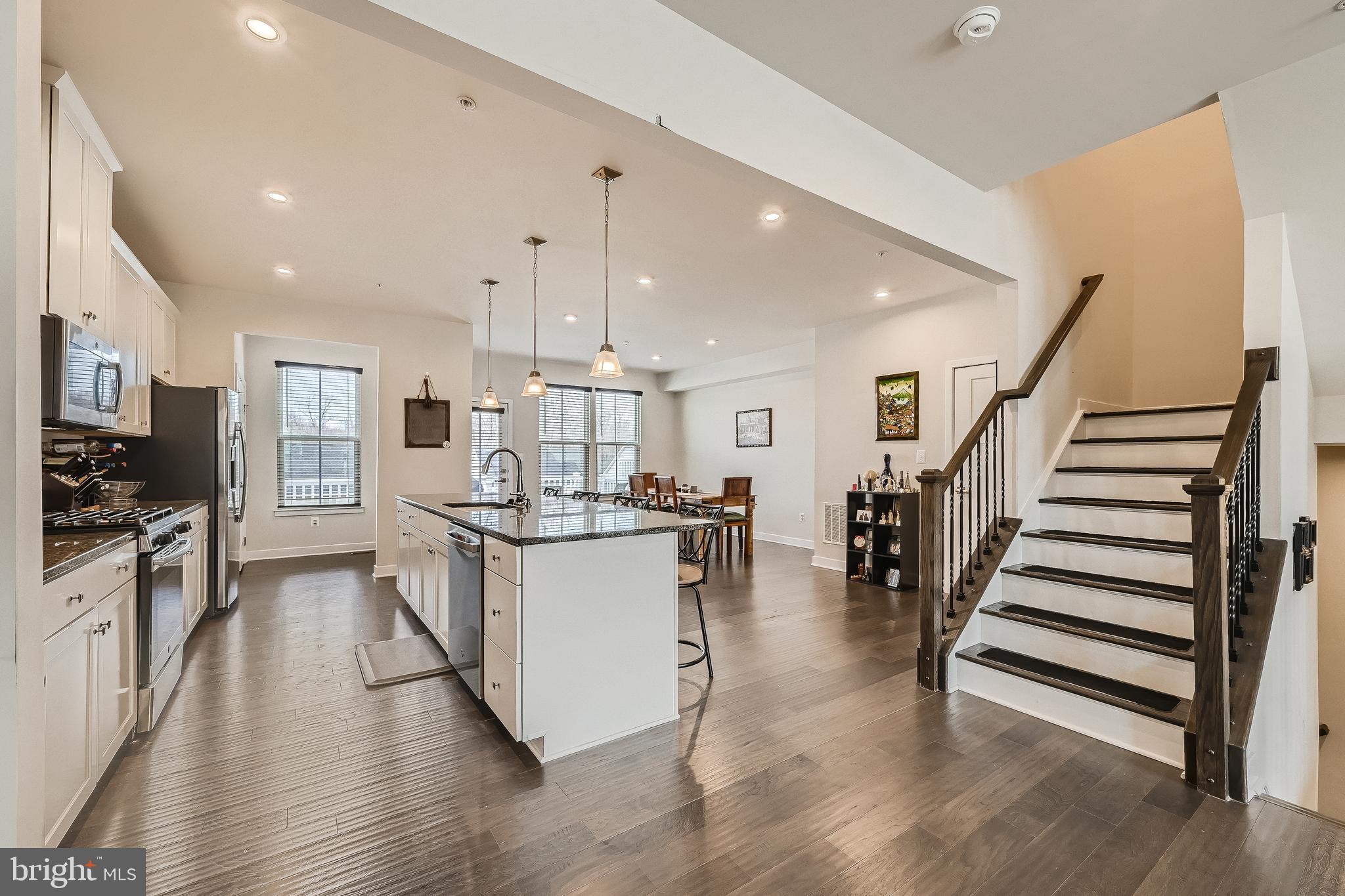 737 Iron Gate Road Bel Air, MD 21014 - Photo 10 of 27 a kitchen with white cabinets and stainless steel appliances