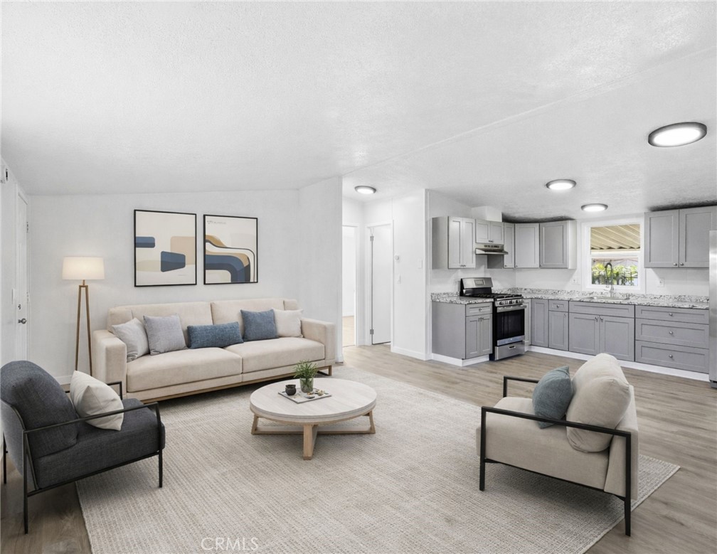 4849 Peck Road, Unit 13 El Monte, CA 91732 - Photo 32 of 32 Please note that the image shown is a virtually staged representation of the room and is intended to provide a visual concept of the space. The actual room may differ in appearance, and the furniture and decor depicted are not included in the sale. For an accurate understanding of the property's current condition and layout, we encourage you to view the home in person. Thank you