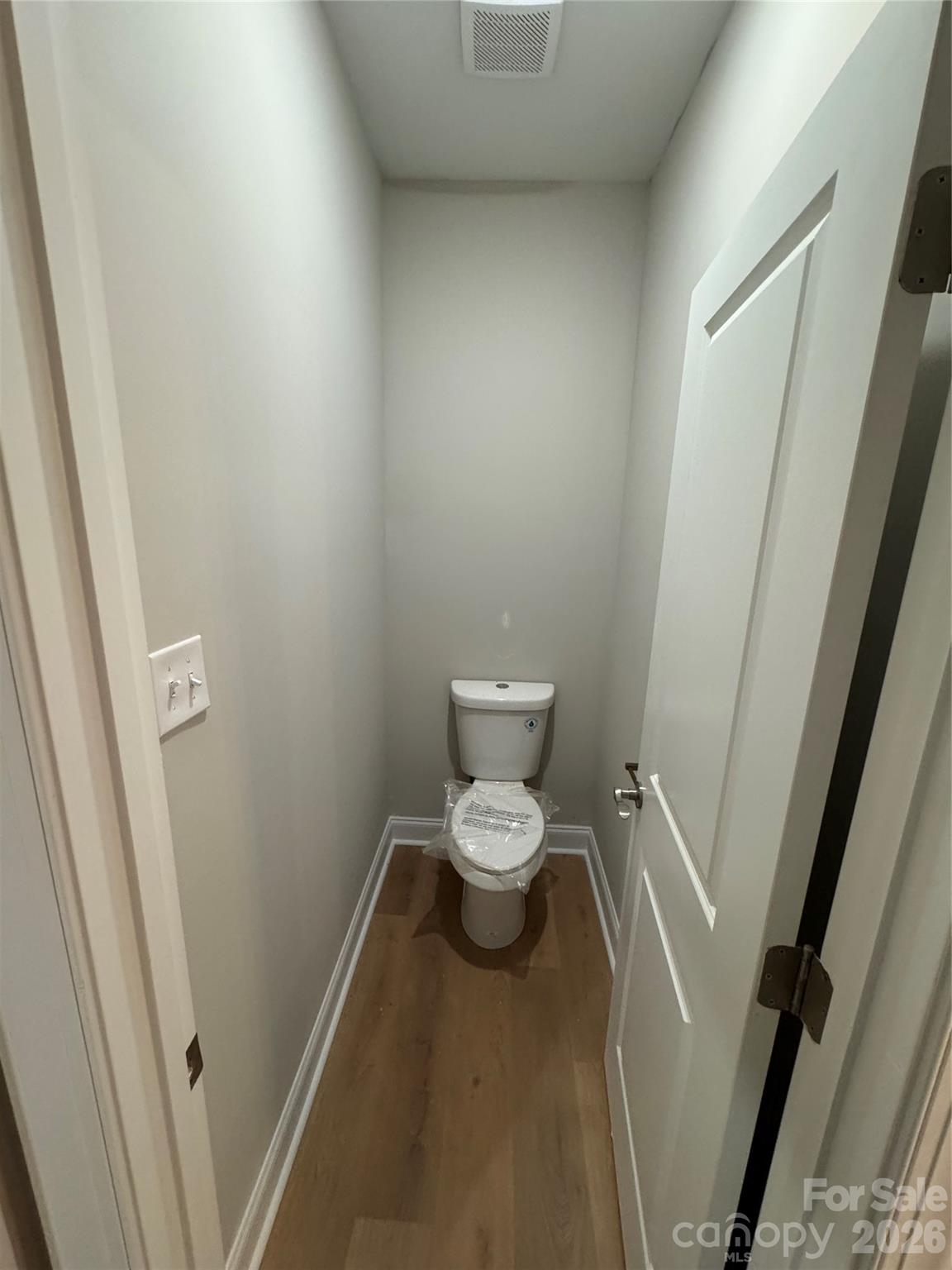203 Lee Street Fort Mill, SC 29715 - Photo 11 of 16 a white toilet sitting next to a sink