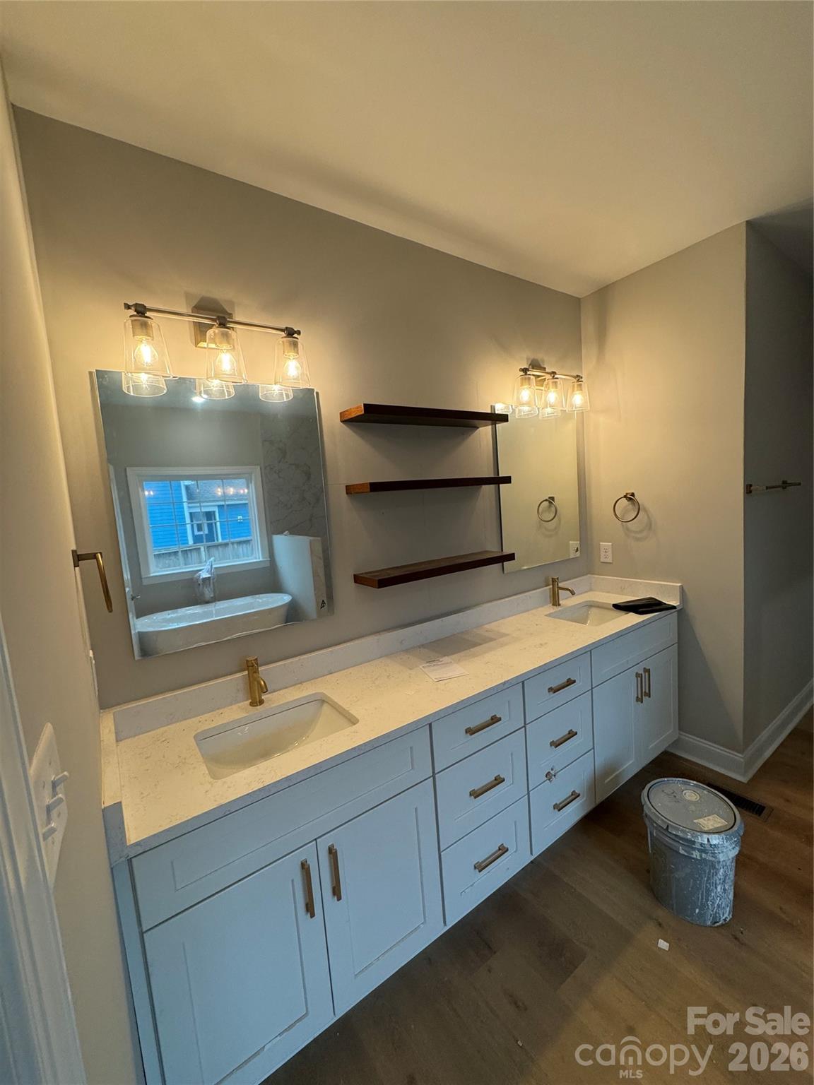 203 Lee Street Fort Mill, SC 29715 - Photo 13 of 16 a bathroom with double vanity sink and a mirror