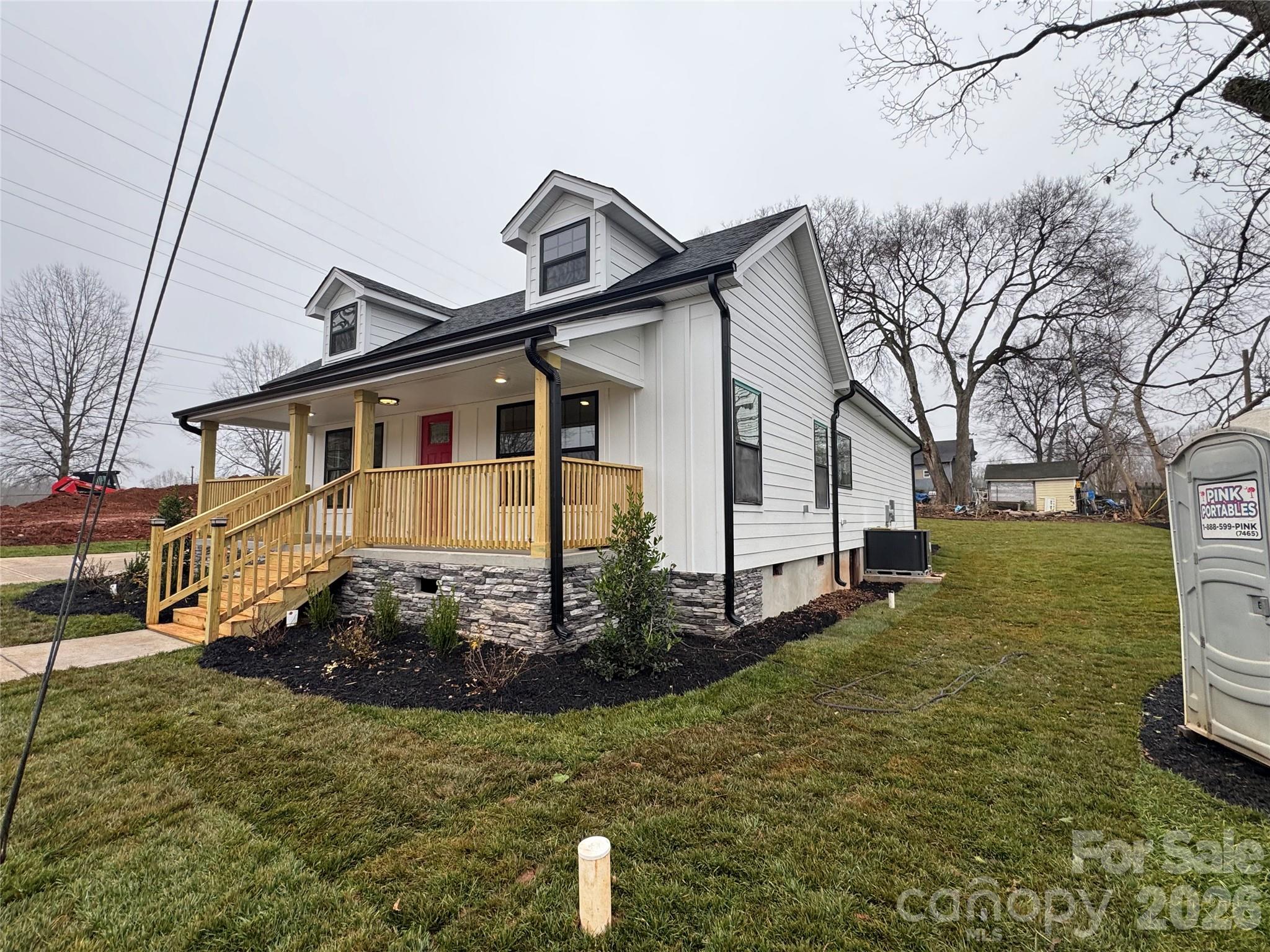 203 Lee Street Fort Mill, SC 29715 - Photo 3 of 16 a front view of a house with garden