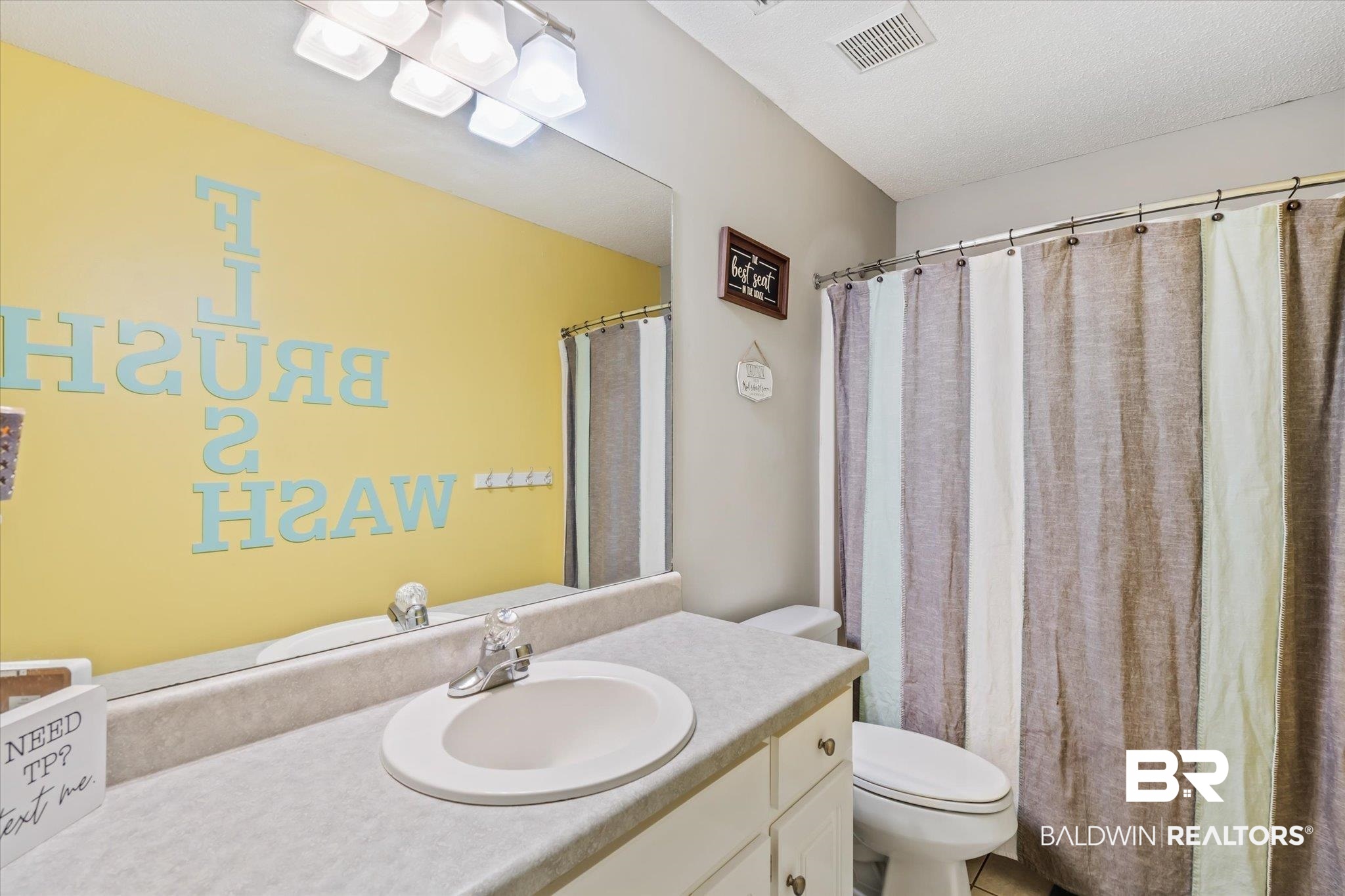 2320 Sequoya Trail Mobile, AL 36695 - Photo 13 of 20 Bathroom with vanity, a textured ceiling, and toilet