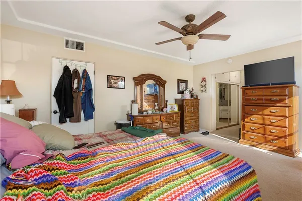 a view of a livingroom with furniture and a window