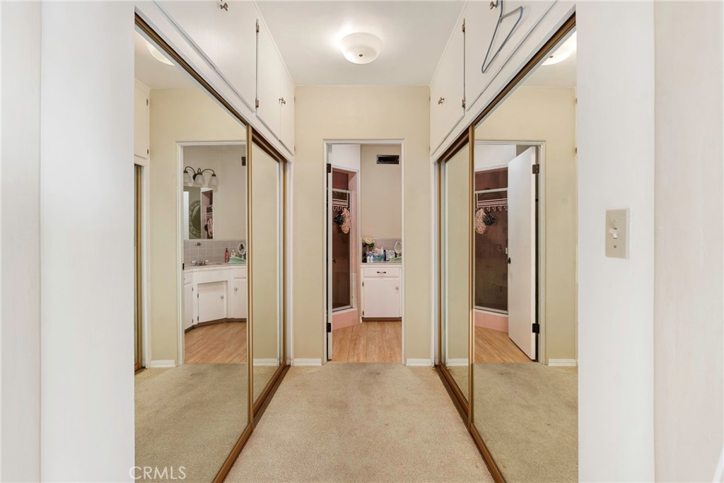 1000 1st Street Wasco, CA 93280 - Photo 15 of 75 a view of a hallway with wooden floor and a bathroom