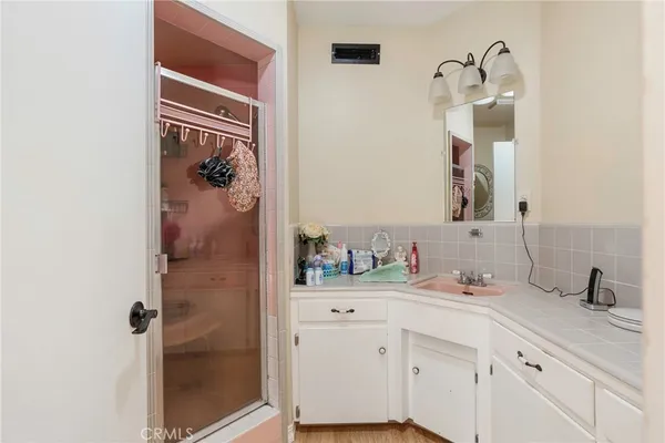 a bathroom with a sink a vanity and a mirror