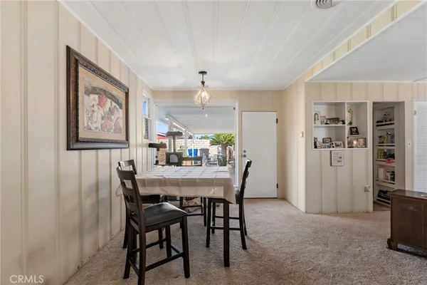 a kitchen with a refrigerator and a stove top oven