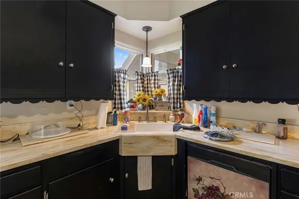 a bedroom with a bed and a flat tv screen on dresser