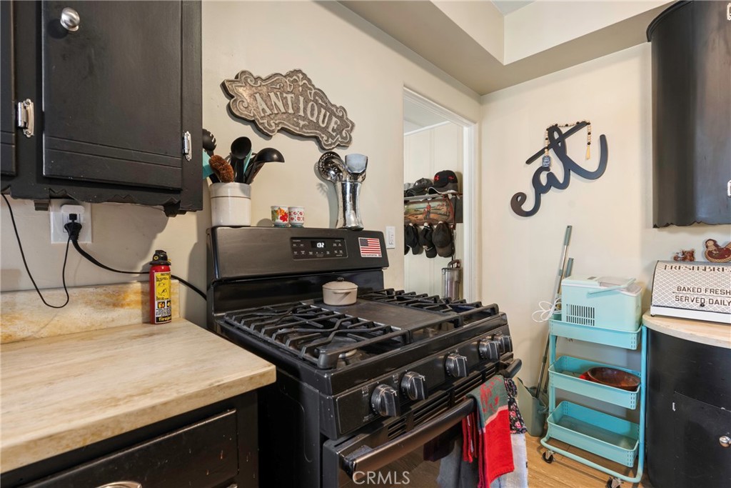 1000 1st Street Wasco, CA 93280 - Photo 27 of 75 a kitchen with a stove and a sink