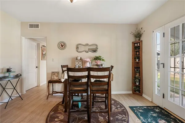 a living room with furniture and a ceiling fan