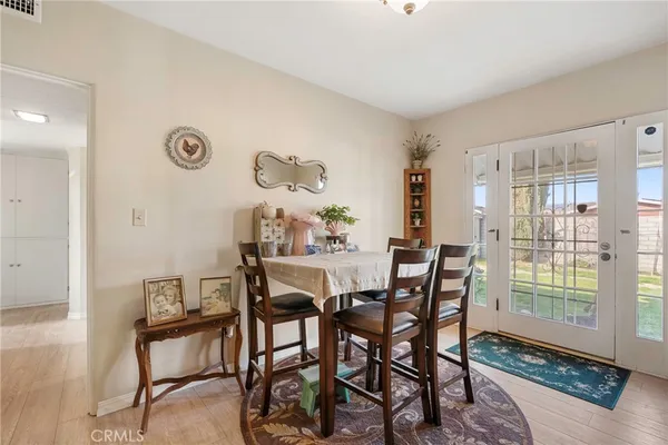 a view of a backyard with plants and palm trees