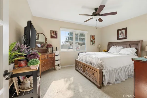 a view of a patio with table and chairs and potted plants