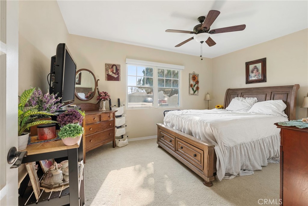 1000 1st Street Wasco, CA 93280 - Photo 33 of 75 a bedroom with a bed table closet and a window