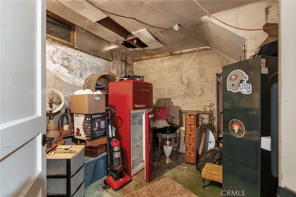 a living room with lots of furniture and kitchen view