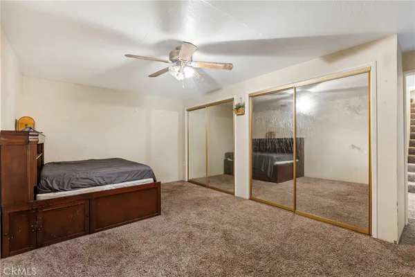 a kitchen that has a lot of cabinets a sink and appliances in it