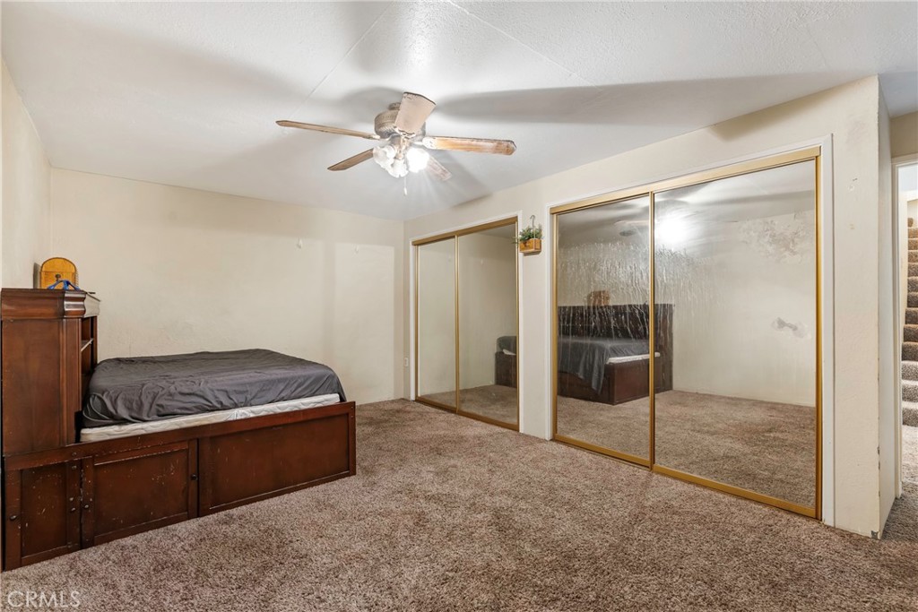 1000 1st Street Wasco, CA 93280 - Photo 41 of 75 a living room with furniture and a ceiling fan