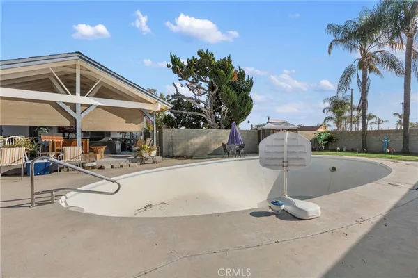a view of a livingroom with furniture and a flat screen tv