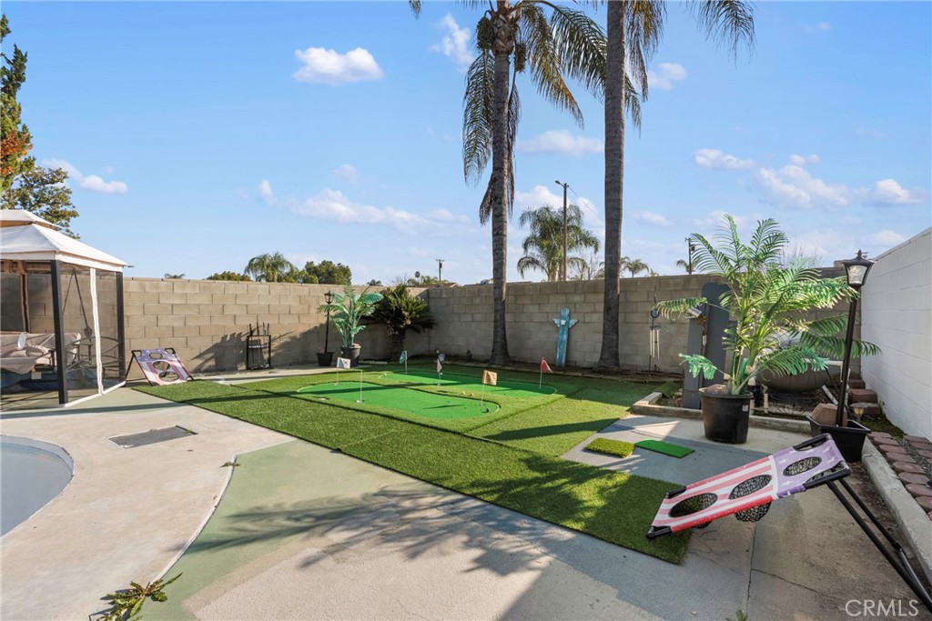 1000 1st Street Wasco, CA 93280 - Photo 46 of 75 a view of a backyard with plants and palm trees