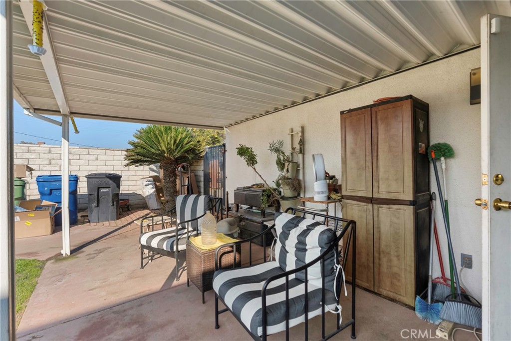 1000 1st Street Wasco, CA 93280 - Photo 51 of 75 a view of a patio with table and chairs and potted plants
