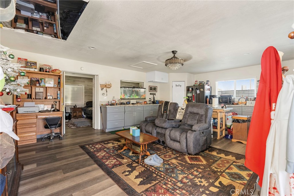 1000 1st Street Wasco, CA 93280 - Photo 57 of 75 a living room with lots of furniture and kitchen view
