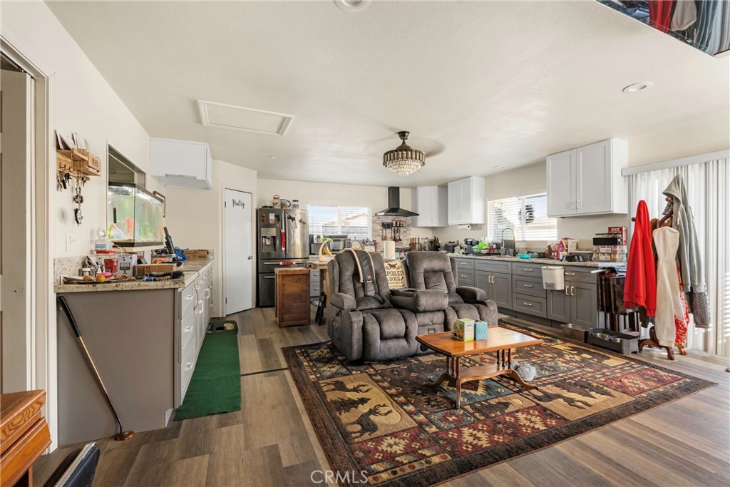 1000 1st Street Wasco, CA 93280 - Photo 58 of 75 a living room with lots of furniture and kitchen view