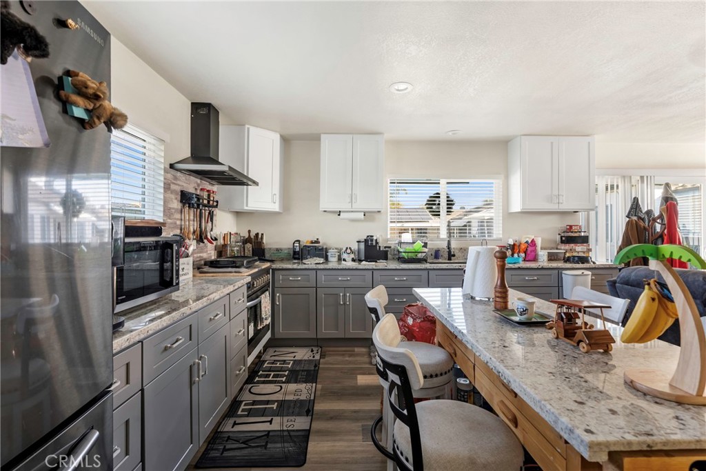 1000 1st Street Wasco, CA 93280 - Photo 62 of 75 a kitchen that has a lot of cabinets a sink and appliances in it