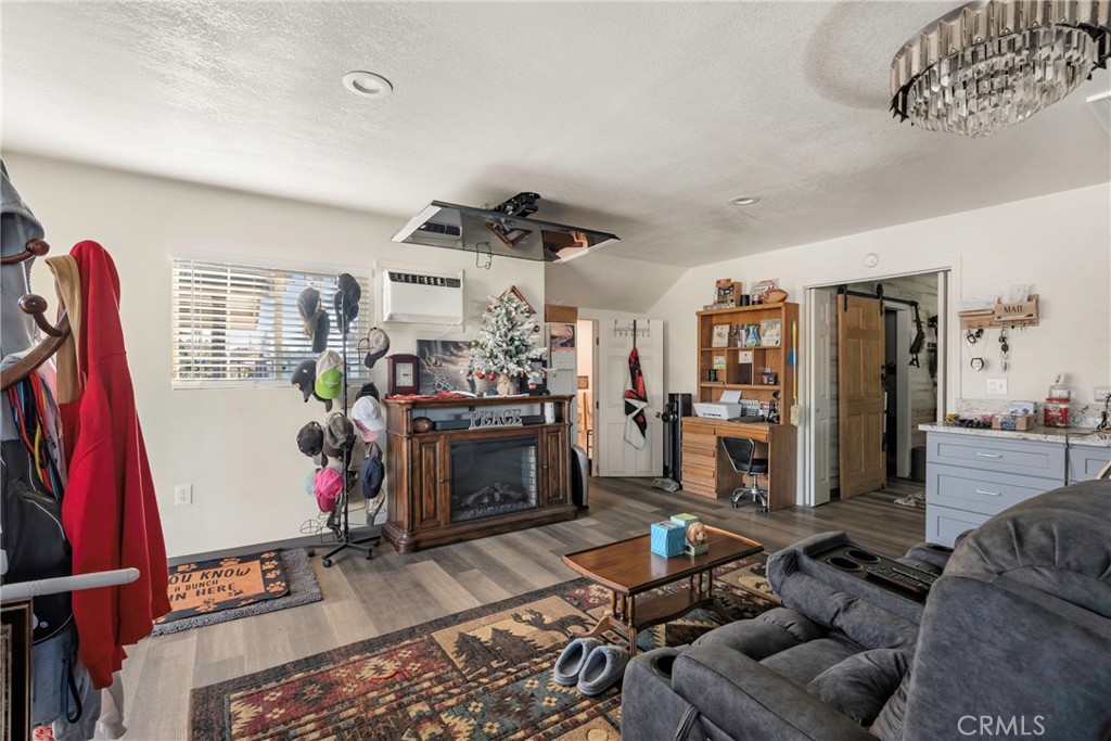 1000 1st Street Wasco, CA 93280 - Photo 65 of 75 a living room with furniture a flat screen tv and a fireplace