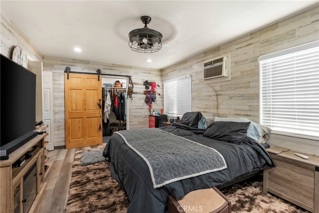 1000 1st Street Wasco, CA 93280 - Photo 68 of 75 a bed room with a bed and a flat screen tv