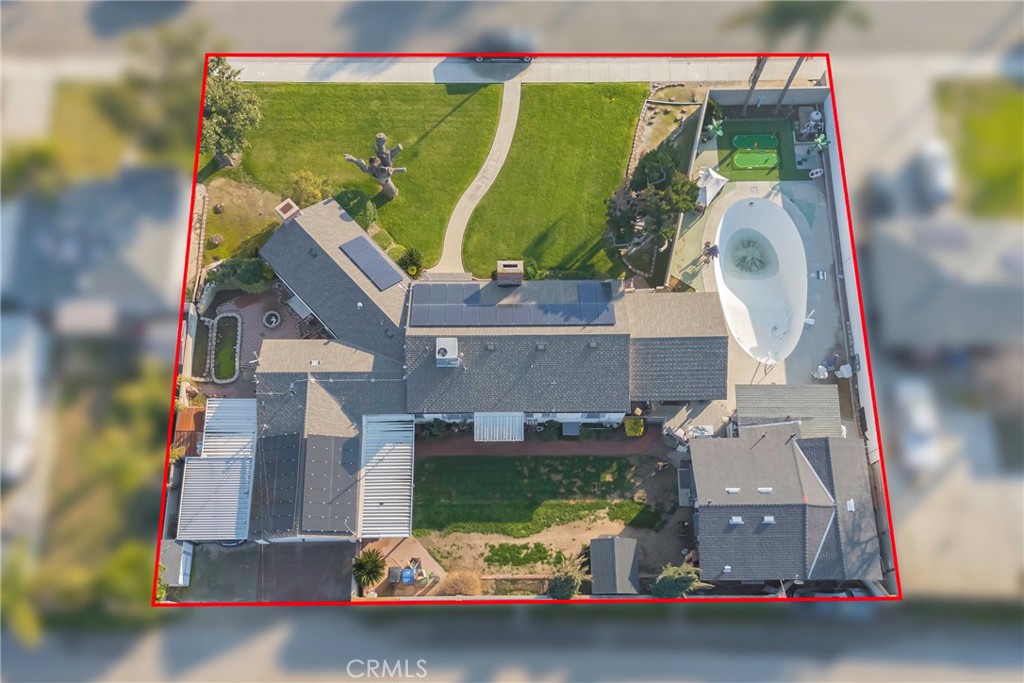 1000 1st Street Wasco, CA 93280 - Photo 73 of 75 an aerial view of a house with a garden and parking space