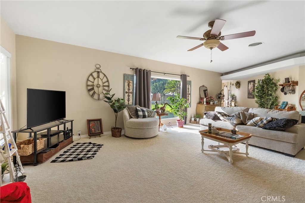 1000 1st Street Wasco, CA 93280 - Photo 9 of 75 a living room with furniture and a flat screen tv