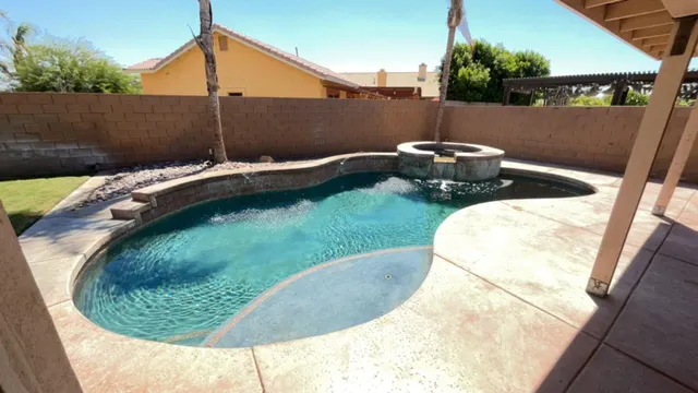 a backyard of a house with a yard and outdoor seating