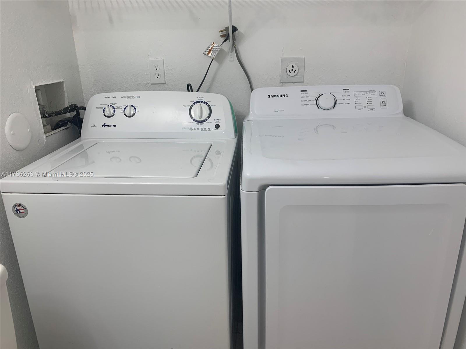 8063 Severn Drive, Unit D Boca Raton, FL 33433 - Photo 11 of 20 a utility room with dryer and washer