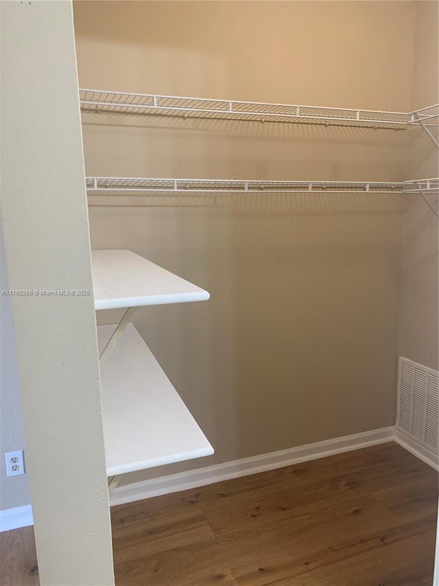 8063 Severn Drive, Unit D Boca Raton, FL 33433 - Photo 13 of 20 a view of a room with racks on the wall