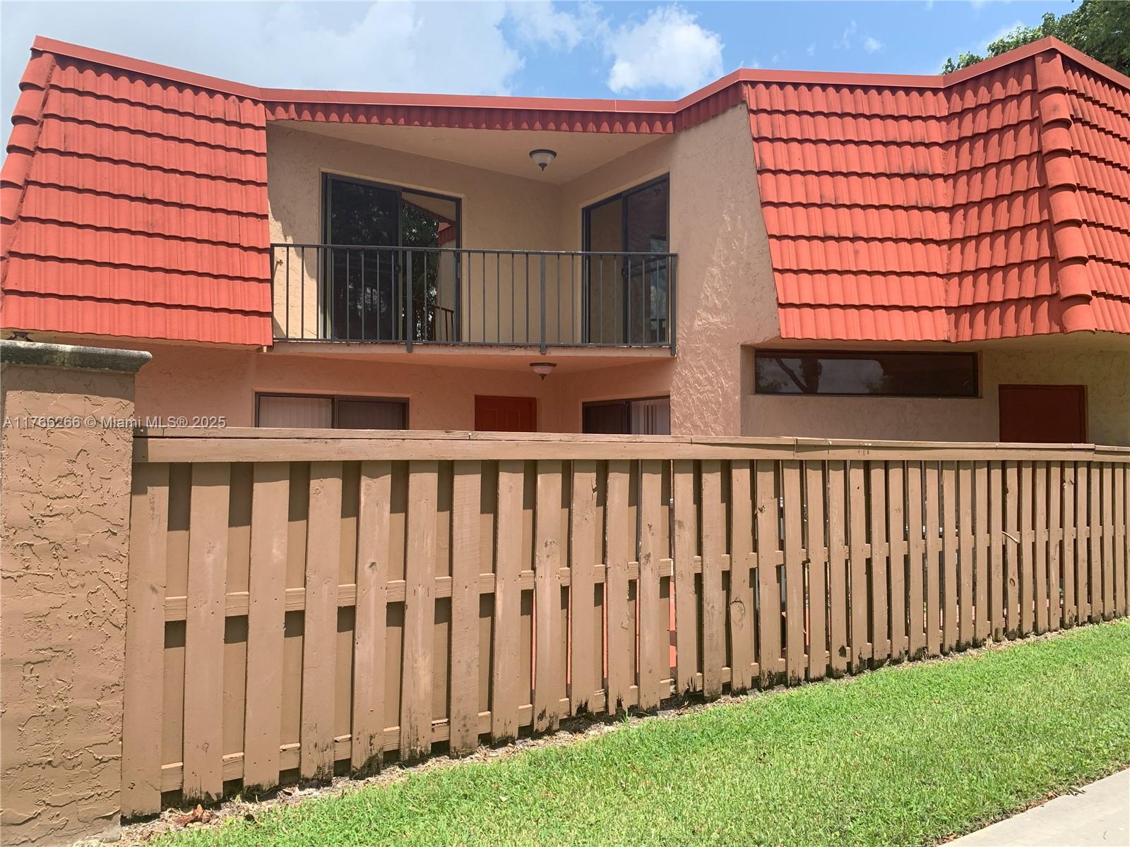 8063 Severn Drive, Unit D Boca Raton, FL 33433 - Photo 6 of 20 a view of a black gate