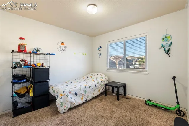 a bedroom with bed and a window