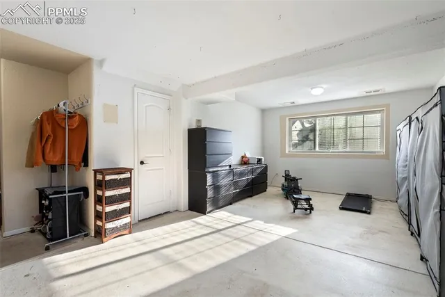 a bedroom with a bed and furniture