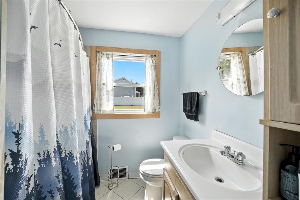 721 Pendleton Avenue Chicopee, MA 01020 - Photo 18 of 36 a bathroom with a sink and a mirror