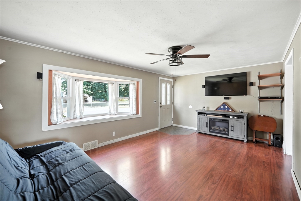721 Pendleton Avenue Chicopee, MA 01020 - Photo 23 of 36 a living room with furniture and a flat screen tv