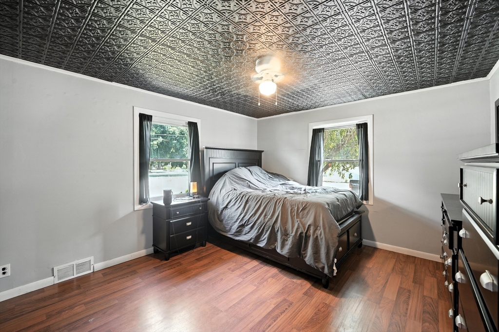 721 Pendleton Avenue Chicopee, MA 01020 - Photo 34 of 36 a bedroom with a bed and wooden floor