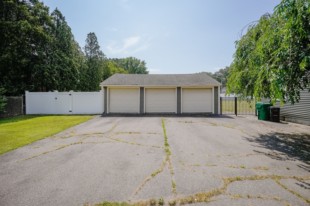 721 Pendleton Avenue Chicopee, MA 01020 - Photo 4 of 36 a front view of a house with a yard and garage