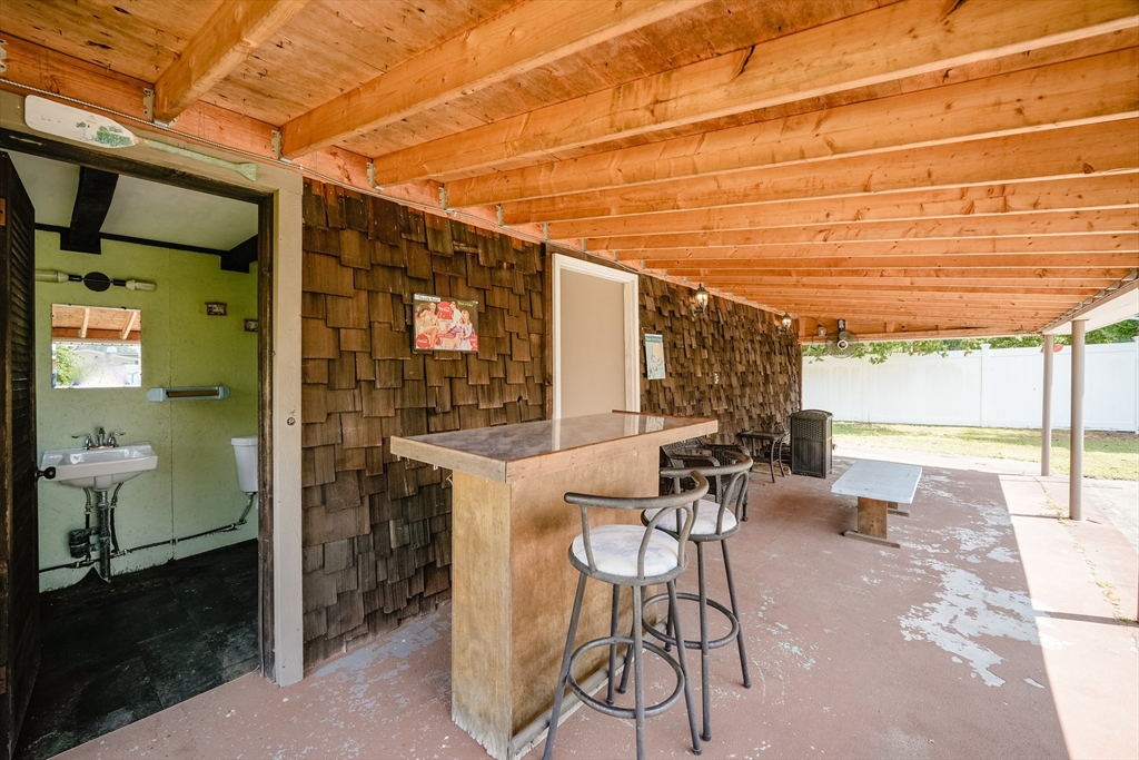 721 Pendleton Avenue Chicopee, MA 01020 - Photo 7 of 36 a view of a patio with table and chairs and potted plants