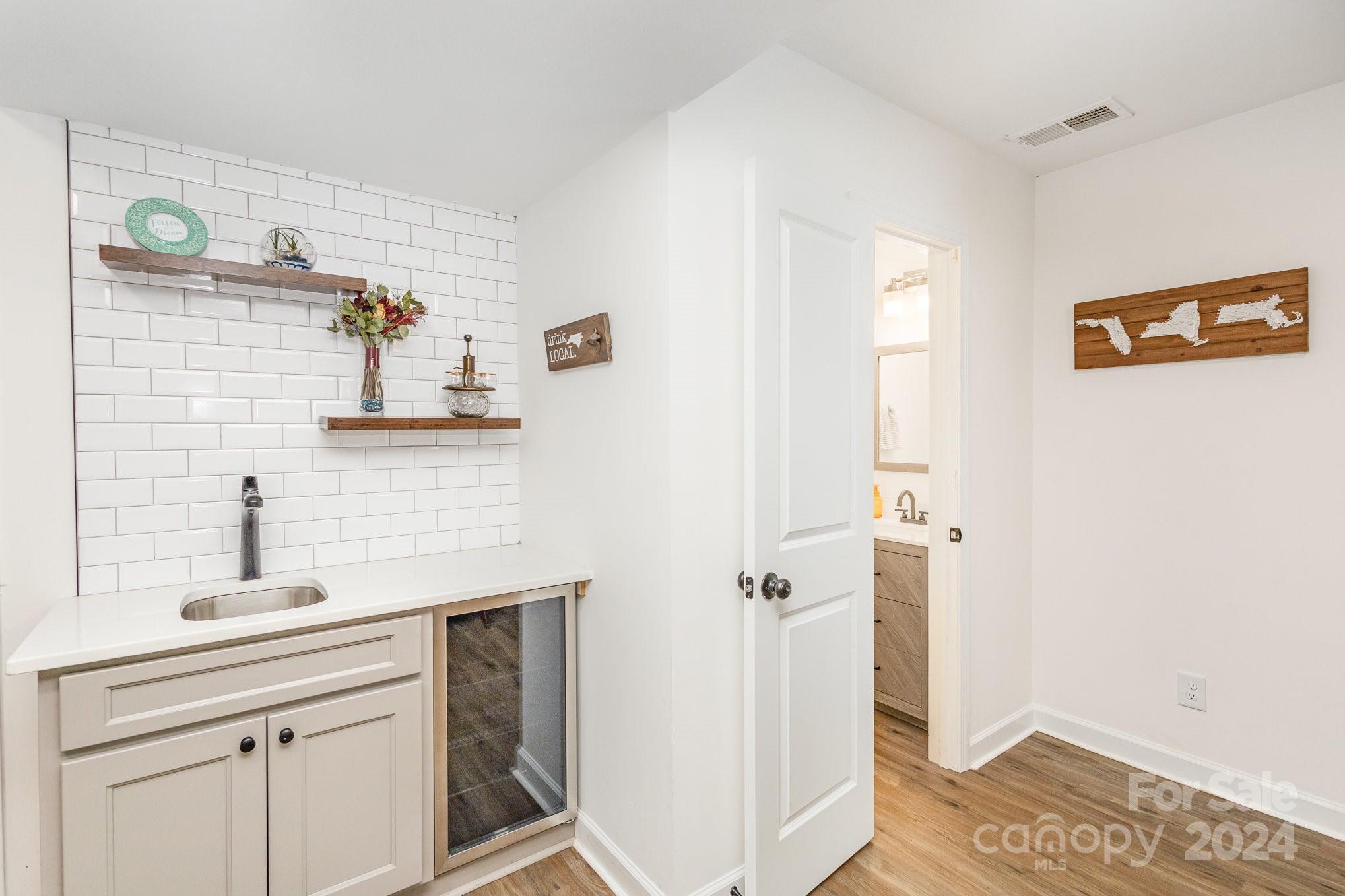 10625 East Lake Road Charlotte, NC 28215 - Photo 16 of 44 a bathroom with a sink and a mirror