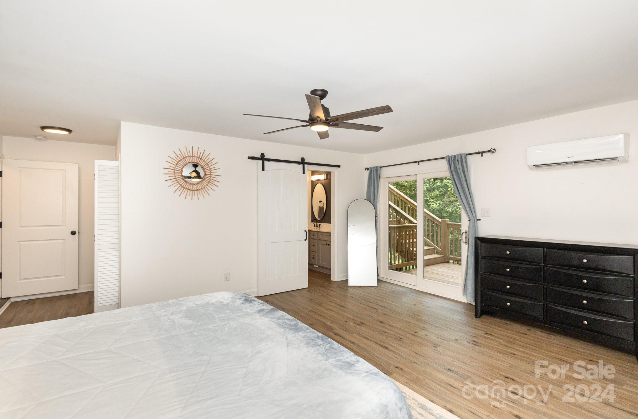 10625 East Lake Road Charlotte, NC 28215 - Photo 21 of 44 a bedroom with a bed and a dresser