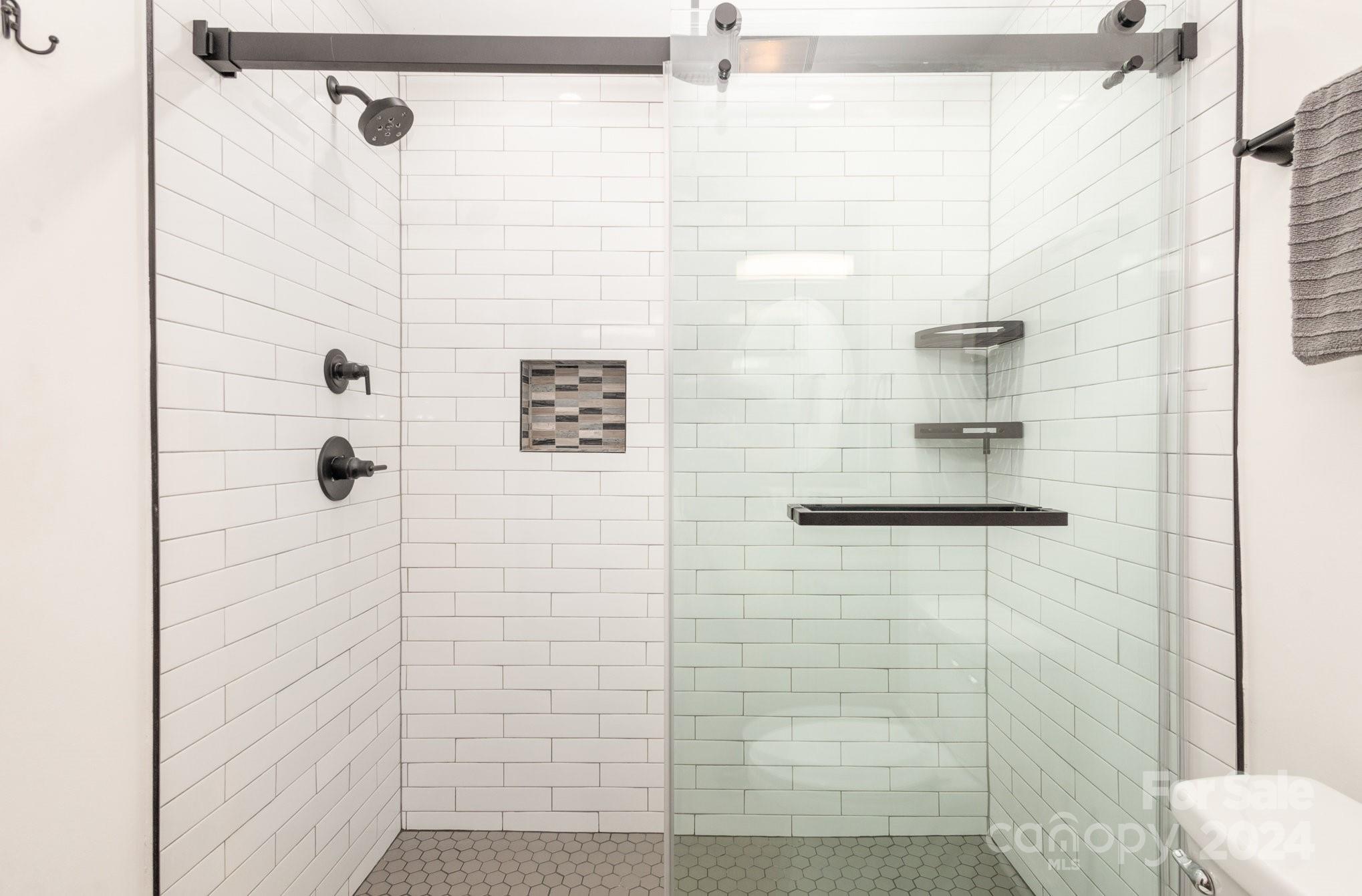 10625 East Lake Road Charlotte, NC 28215 - Photo 24 of 44 a bathroom with a shower