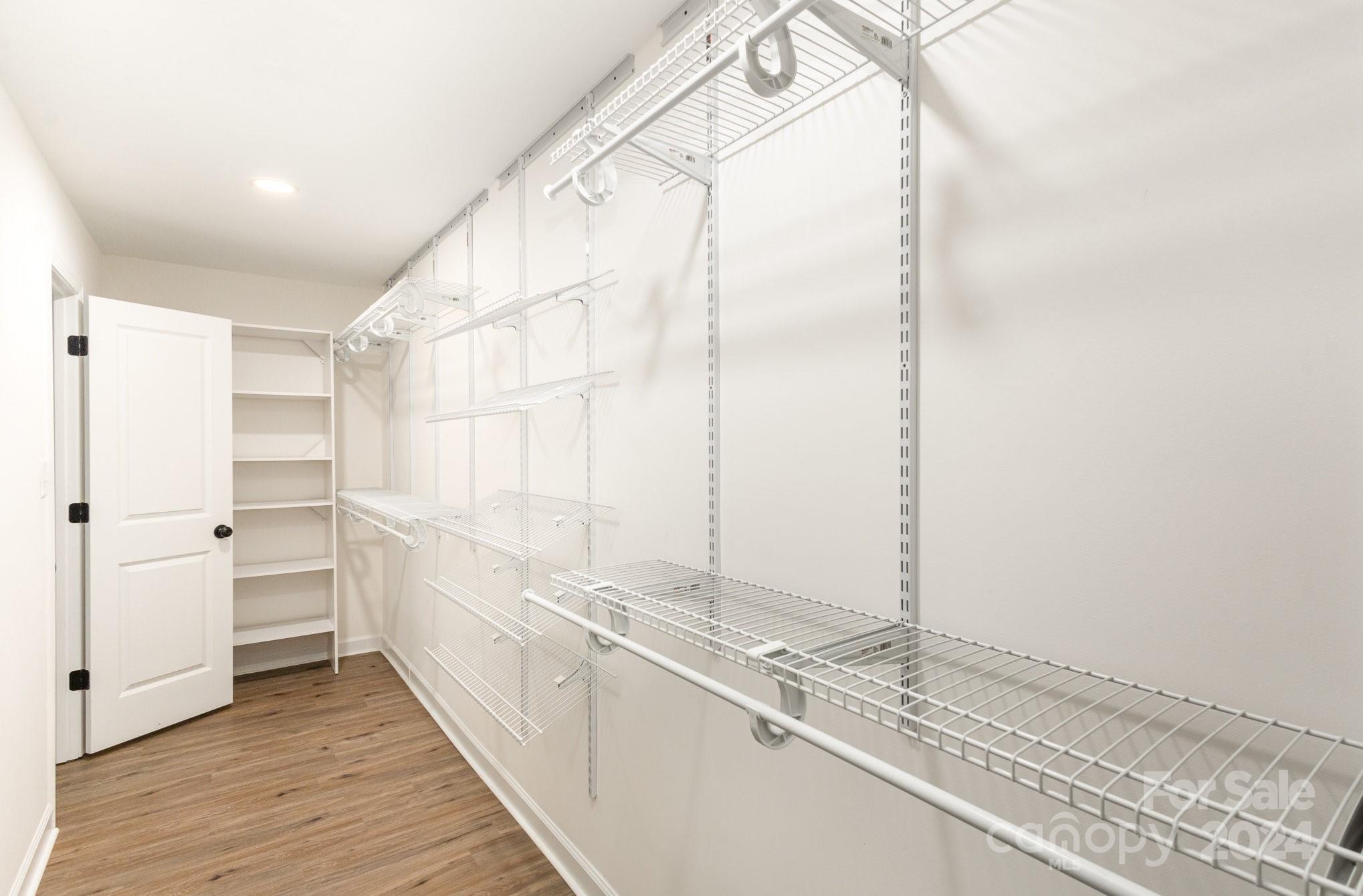 10625 East Lake Road Charlotte, NC 28215 - Photo 25 of 44 a bathroom with a double vanity sink and mirror