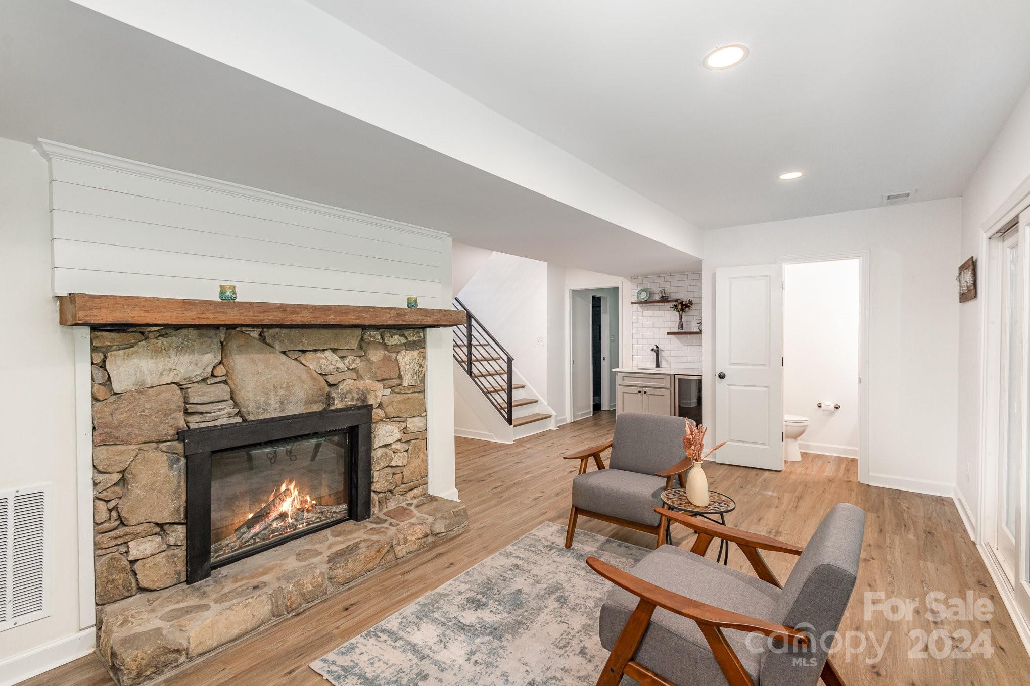10625 East Lake Road Charlotte, NC 28215 - Photo 34 of 44 a living room with furniture and a fireplace