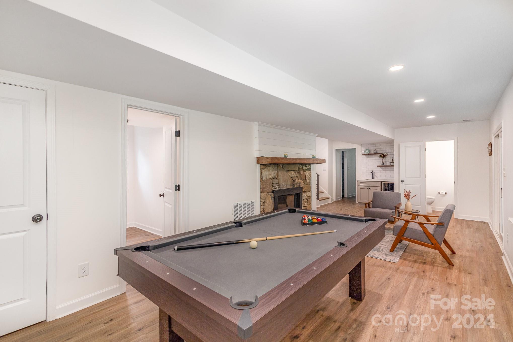 10625 East Lake Road Charlotte, NC 28215 - Photo 35 of 44 a living room with stainless steel appliances furniture and a table